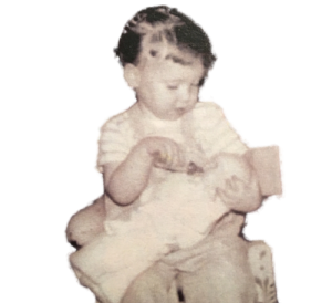 young Vicki with a doll
